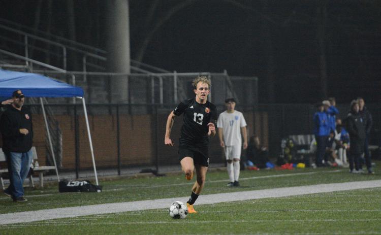 Will Bell scores the opening goal in the 4-0 road win against Oglethorpe County Feb. 10. Photo by Benjamin London.