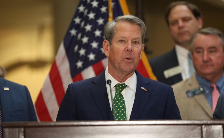 Gov. Brian Kemp speaks before signing Georgia House Bills 1199 and 1000 into law at the Georgia State Capitol March 20. The laws suspend the state motor fuel tax for 60 days and implement one-time income tax rebates. Photo by Ashtin Barker, Capitol Beat