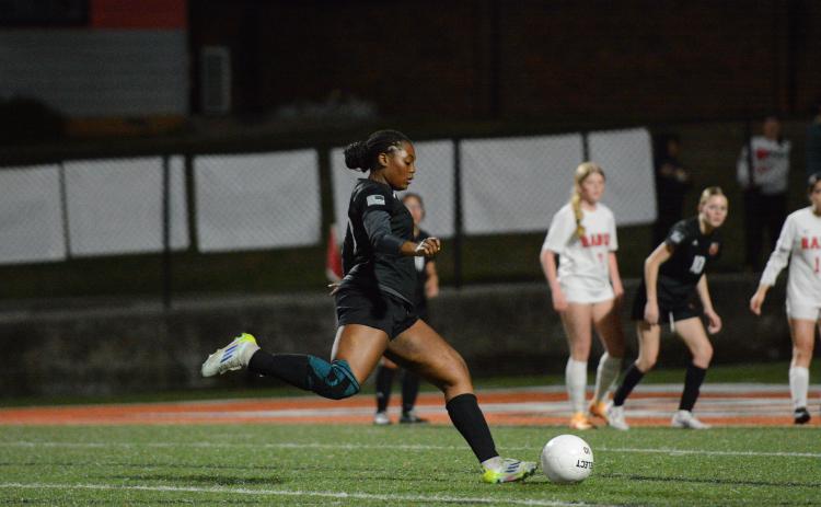 Centerback Aidyn Craft scores off a free kick in the 6-2 win over the Lady Wildcats of Rabun County Feb. 27. Photo by Benjamin London.