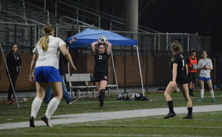 Midfielder Madison Heaton throws the ball into play during a match earlier in the season, as she scored two goals in the 6-0 win over Greene County March 16. Photo by Benjamin London.