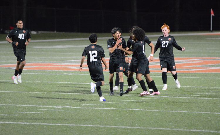 Midfielder Noé Ramírez Padilla celebrates after scoring from long range in the 4-0 win over the Wildcats of Rabun County Feb. 27. Photo by Benjamin London.