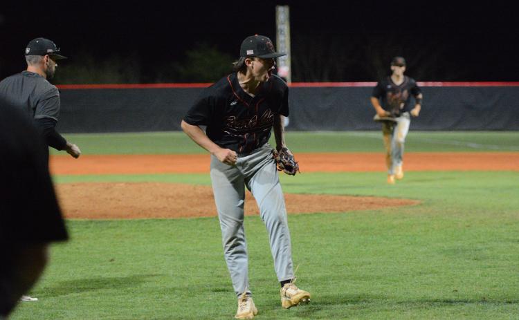 Sophomore pitcher Aiden Kennedy celebrates after striking out the final batter to hang on to win, 7-6, against the Indians of Stephens County in eight innings March 30. Photo by Benjamin London.