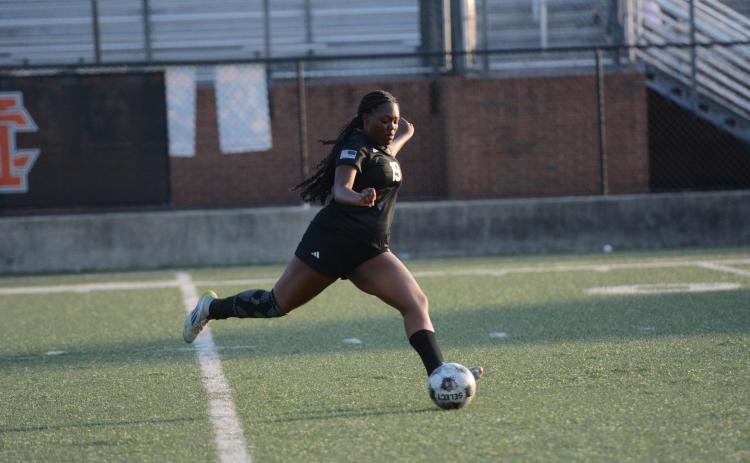 Aidyn Craft takes a free kick, as she later scored on a penalty kick in the 4-2 loss to Lady Cavaliers of Callaway in the first round of the state playoffs April 23.  Photo by Benjamin London.