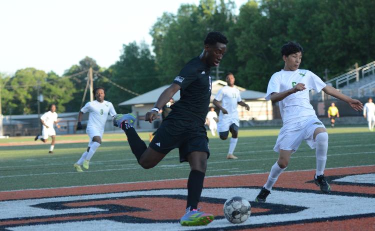 Cayson Craft scores his fourth goal out of the five goals he scored in the 10-1 win over the Eagles of Josey April 16.  Photo by Benjamin London.