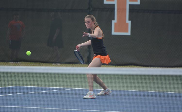 Senior Lucee Patrick rears back to return the serve, as the Lady Dogs fell just short on senior night to the Lady Indians of Stephens County, 3-2, March 26.  Photo by Benjamin London.