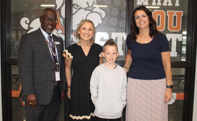 Pictured (L-R), are North Hart Elementary Assistant Principal David Pressley, Principal Christina Weir, second-grade student Parker Holmes and  second-grade teacher Amy  Martin. Photo by Grayson Williams.