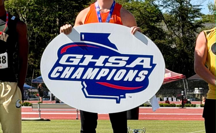 Senior pole vaulter Luke Samples on the podium after capturing his third state title in the event May 14. Photo submitted by Sissie Samples.