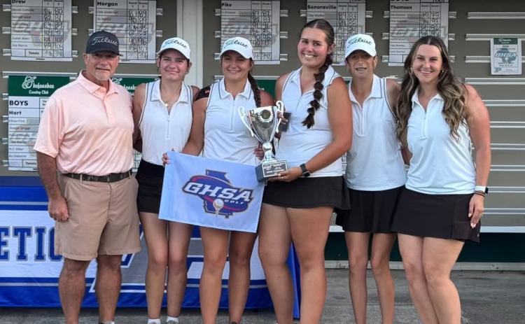 The Lady Dogs pose with the State Championship trophy after capturing the state title in Blackshear at the Okefenokee Country Club May 18-19.  Photo submitted by Hart County Golf.