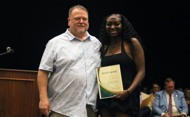 Left, Zy'tajia Moore (right) was awarded the Kelley Gaines TSA Memorial Scholarship by Greg Gaines during the senior awards night at Hart County High School April 29. Photo courtesy of Hart County Charter System.