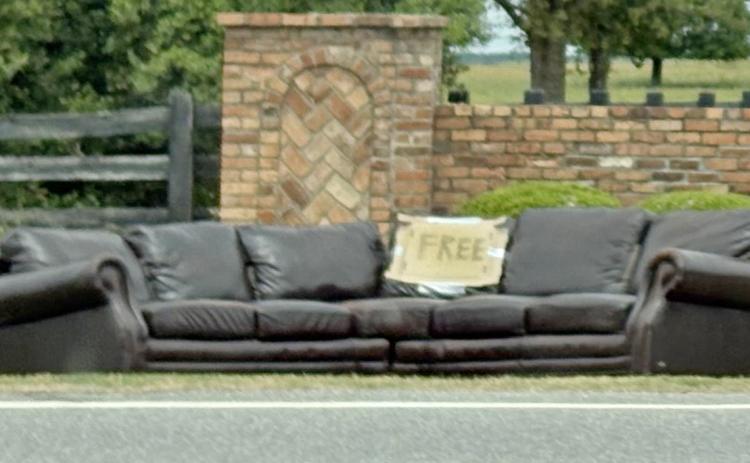 With a “FREE” sign attached to this brown leather couch, it didn’t take long for the next owner to snare the sofa from the country roadside. Photo submitted by Dink NeSmith.