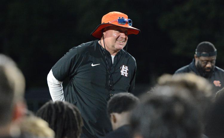 Hart County’s new head football coach Biff Parson speaks with the team after their first summer practice June 2. Photo by Benjamin London.