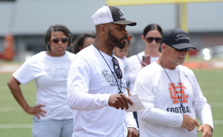 Campers compete in multiple offensive and defensive position drills in the second annual Harper Island Training Youth Football Camp lead by Class of 2004’s Mikendric Harper (pictured middle) June 20. Photo by Benjamin London.