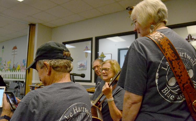 Above (L-R) Richard Frady, Daniel Meth, Jo Ann Moore and Terri Cleveland prepare for a performance at the Hart County Senior Center. Photo by Madison Linton.