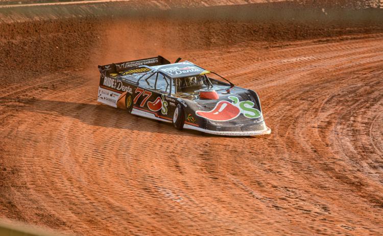 NASCAR Cup Series driver Carson Hocevar drives his No. 77 Ride the ‘Dente Chilli’s Chevrolet into the turn at Lavonia Speedway July 10. Photo by Benjamin London.