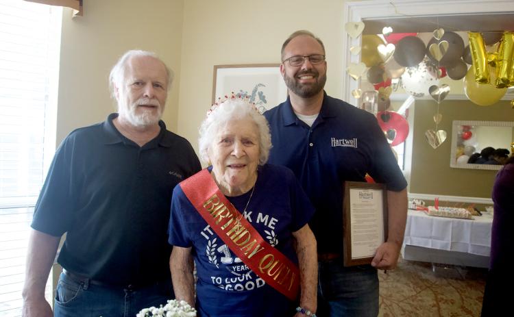Photo by Madison Linton Hart County's oldest resident, Doris Mahannah (front) was honored with proclamations by Hart County Board of Commissioners Chairman Marshall Sayer (left) and City of Hartwell Mayor Brandon Johnson (right) during her birthday celebration at Brookdale on her 110th birthday June 24.