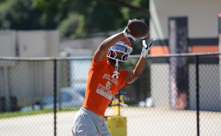 Senior wide receiver PJ Johnson makes the catch during a practice on July 16. Photo by Benjamin London.