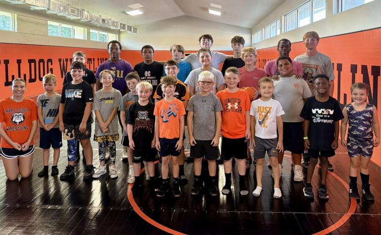 Pictured is the morning group of campers ages five to 12-years-old, along with former and current wrestlers who participated in the basics to wrestling camp July 17.  Photo submitted by Hart County Wrestling.