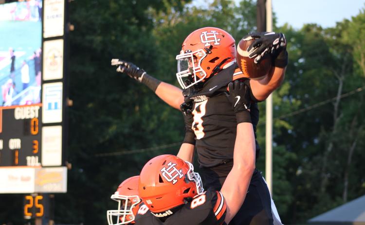 Senior running back Kaidyn Allen celebrates after scoring the opening touchdown in the 51-3 win over the Raiders of Habersham Central Aug. 21. Photo by Grayson Williams. 