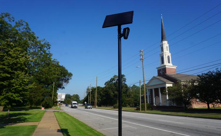 A flock camera in the City of Hartwell. State lawmakers are working to curb misuse of the cameras after several arrests statewide.  Photo by Madison Linton. 