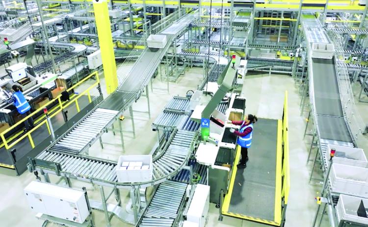 A screenshot from a Walmart promotional video shows the inside of the company’s next-generation fulfillment centers that combine the work of employees, robotics and automated shipping technology to move packages to customers. Walmart announced last week that a new next-generation fulfillment center will be built in Franklin County and employ 1,000 workers. Photo courtesy of Walmart.com.