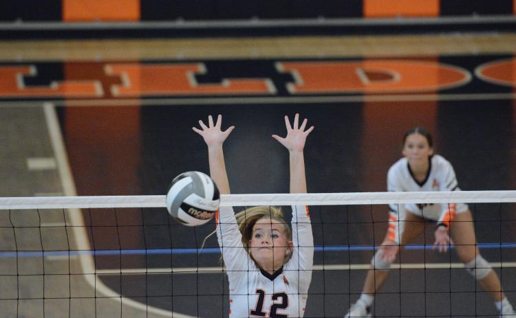 Junior middle Blair Allen collects a block in the 3-0 win against Elbert County Oct. 6. Photo by Benjamin London. 