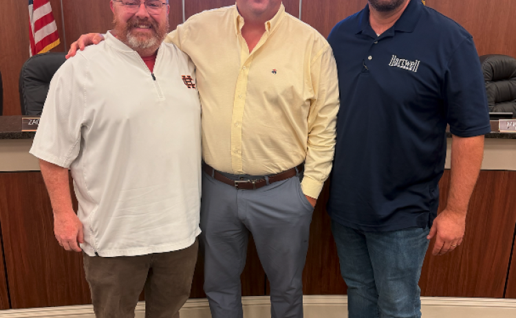 Hartwell Economic and Community Development Director Jason Ford (left) wrapped up over eight years with the city this week. He is pictured following Monday's city council  meeting with City Manager Jon Herschell (center) and Mayor Brandon Johnson (right). Photo by Rose Scoggins.