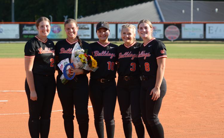 Pictured above from left to right are seniors MaryBeth White, Chesnee Strickland, Kamyrn McIntosh, Carly Dutton and Peyton McCollum, as their careers for the Lady Dogs came to an end in the Sweet Sixteen following a 9-0 and 15-0 loss to the No. 1 seeded Lady Pirates of Appling County Oct. 19. Photo by Benjamin London.