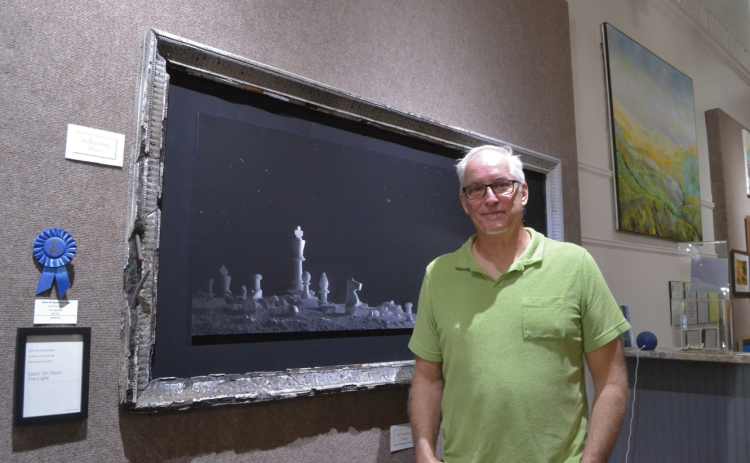 Hartwell photographer and Barking Dog Studios owner John Cumming won first place in the 2026 Annual Regional Juried Art Show for “Soon, Oh Soon the Light”, a carefully constructed photograph inspired by “The Gates of Delirium,” a 22-minute battle depiction in song form by the English rock band Yes.  Photo by Madison Linton.