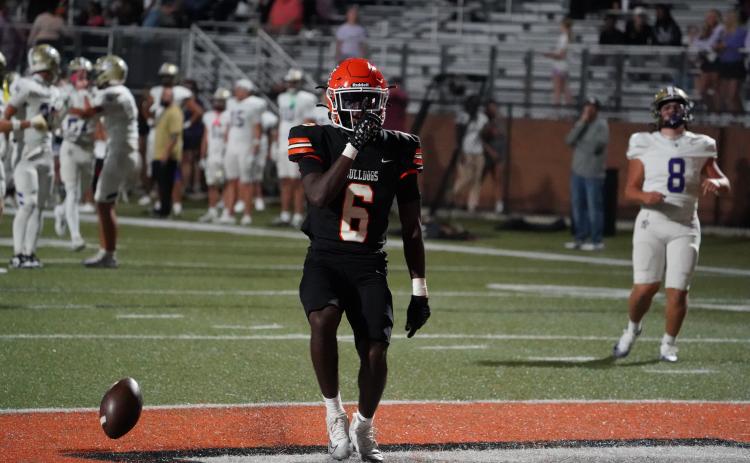 Senior running back Xavier Allen celebrates after a touchdown run that was later called back, as the Dogs went on to defeat the Indians of Lumpkin County 50-14 to remain undefeated. Photo by Ric Williams. 