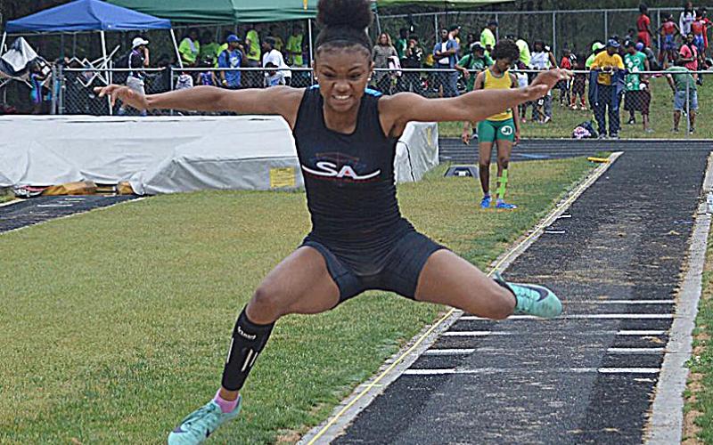 Valasha Carter competes in the triple jump at a recent event. 