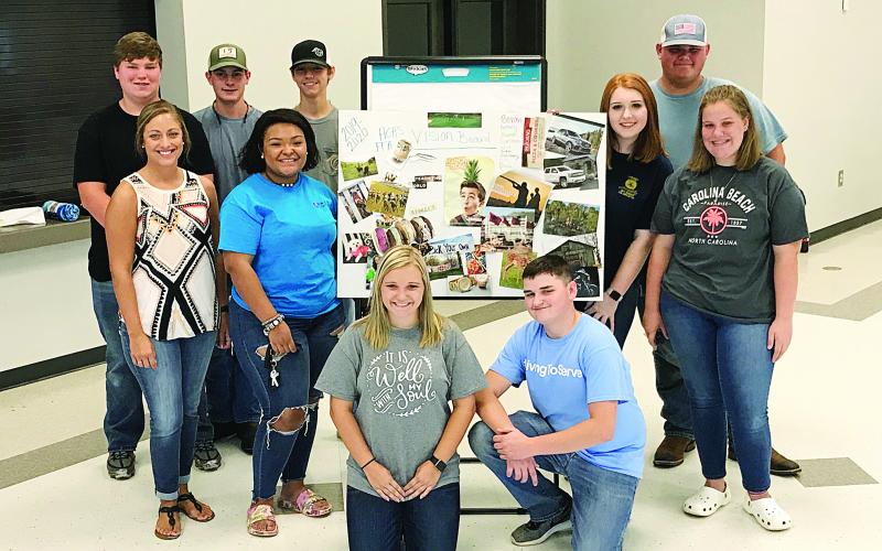 Provided photo — FFA officers show off some of their work at their summer retreat at the Hart County AgriScience Center this past summer. They are, from left to right, Jordan Teel, Anna Smith, Larson Craft, Hannah Ball, Kimberly McCall, Zachary Haygood, Bekah Stewart, Dylan Trotter and Dianna Nolan.