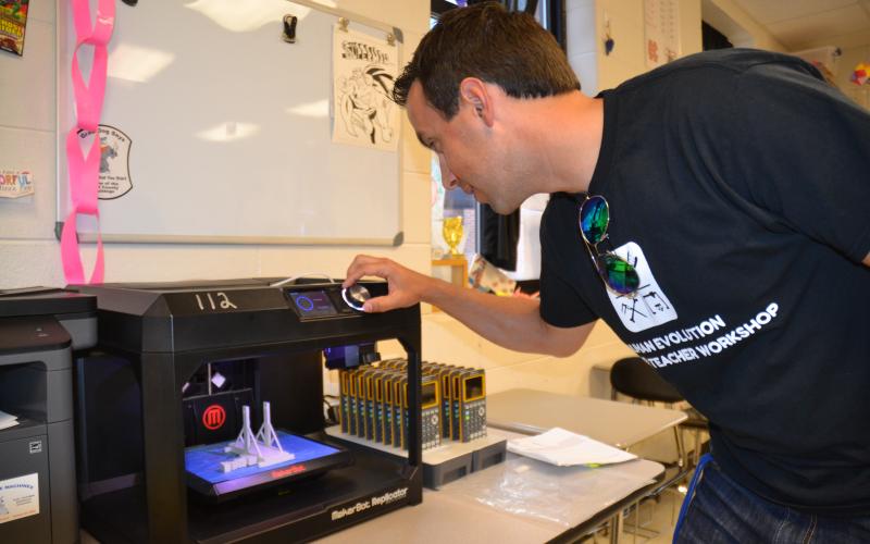 Hart County High School science teacher Justin Lee recently spent some time at a workshop at the University of Florida learning more about human evolution and how to print 3-D replicas of hominid skulls to incorporate into his curriculum. Pictured, Lee readies the 3-D printer at HCHS to give his students the ultimate experience on the subject.