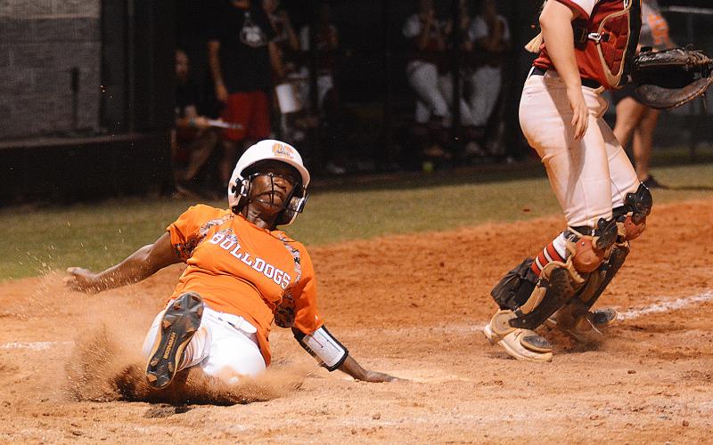 Sunshot by Grayson Williams — Hart County’s Red Campbell slides into home to score in the bottom of the sixth inning on Aug. 15 against Morgan County.