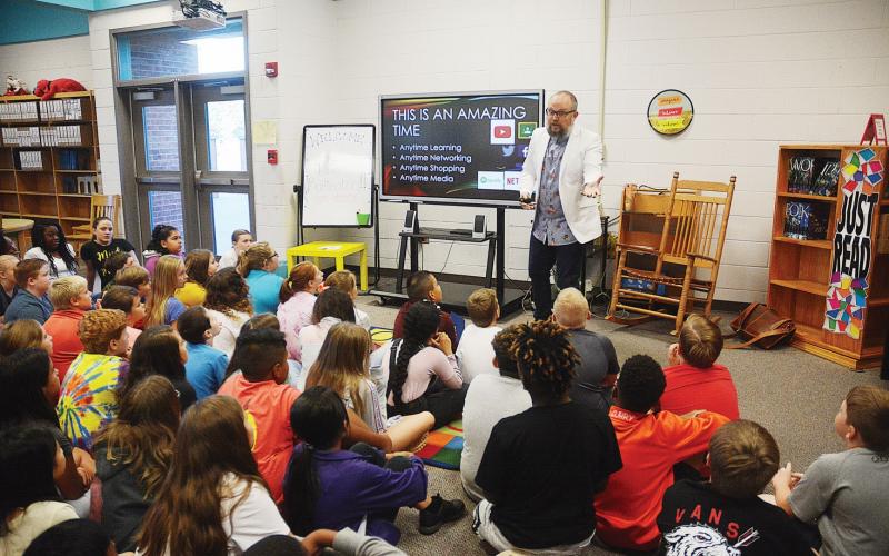 Sunshot by Michael Hall -- A group of fifth-grade students at South Hart Elementary listen on Aug. 29 to Brian Buffington, director of instructional technology for Pioneer RESA, teach about how to stay safe and be positive on social media and online.