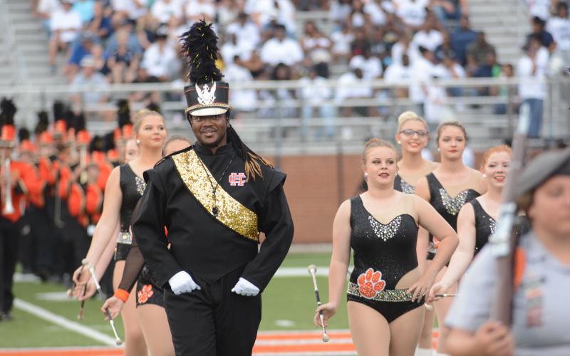 File photo — Drum Major Rendarris Gaines leads the Bulldog Band on the field this season. 
