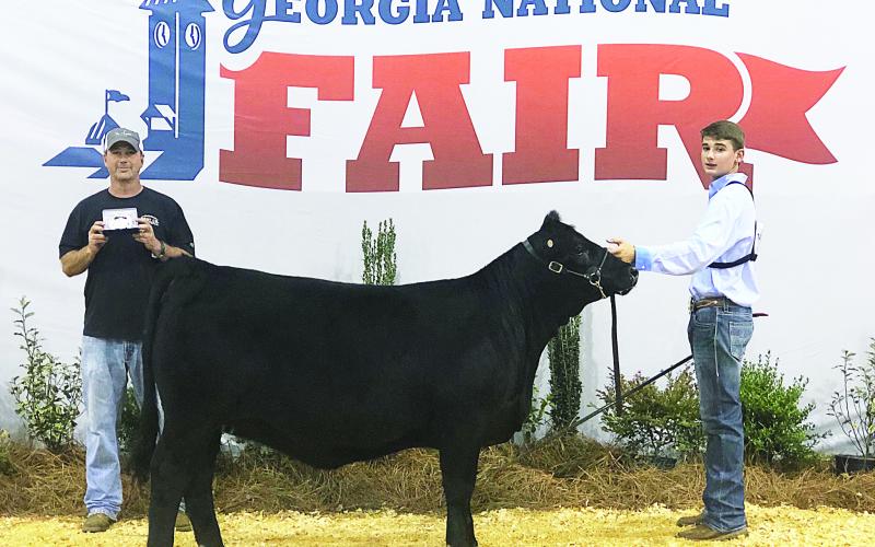 Trey Chafin, right, won 8th Grade Beef Cattle Showmanship both weekends of the fair.