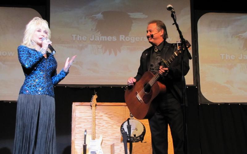 James Rogers performs with Dolly Parton