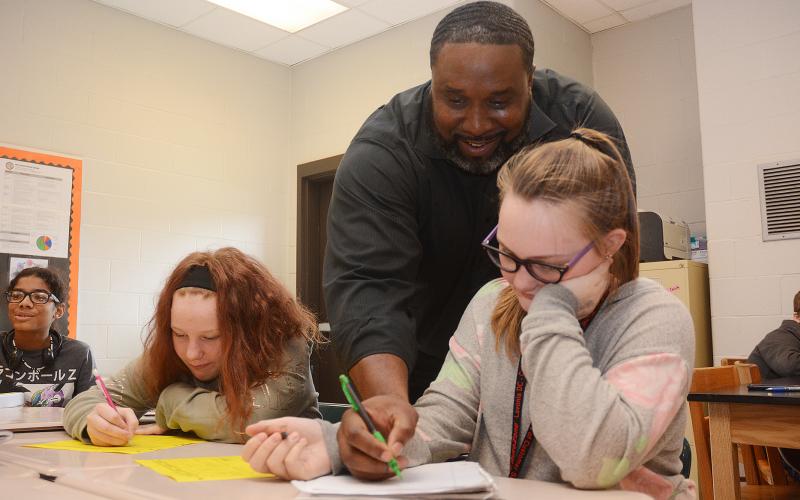 Sunshot by Michael Hall — Middle school teacher Earl Fouch helps students during a math exercise at Hart County Middle School on Monday, Nov. 4. 