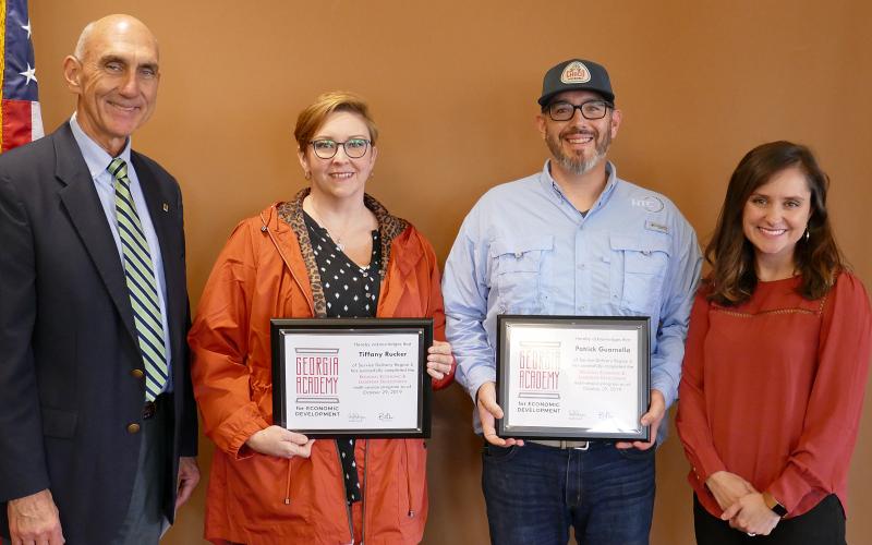 Tiffany Rucker and Patrick Guarnella, center, are pictured with Carrie Barnes of Georgia EMC and Rope Roberts Georgia Power Co.