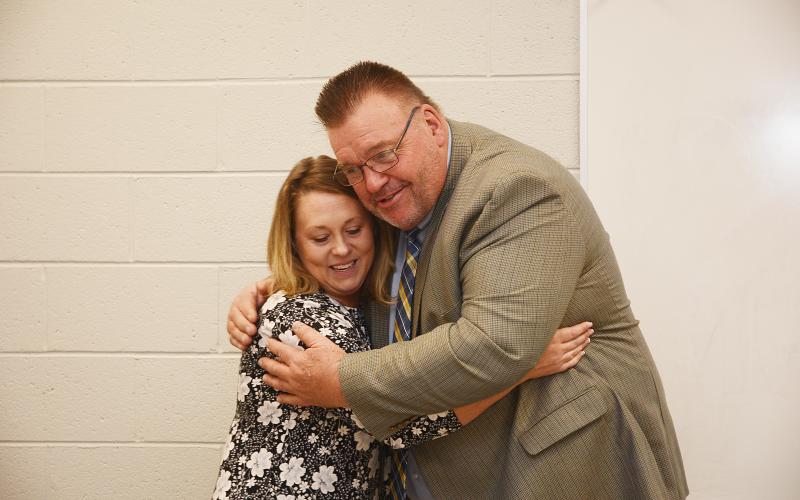 Sunshot by Michael Hall — Hart County Teacher of the Year Christie Simpson, left, hugs Superintendent Jay Floyd on Nov. 15 at the Hart College and Career Academy’s community room after she was announced as the system-wide winner of the award.