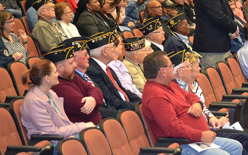 Sunshot by Drew Dotson - Veterans sit and listen to the program put on at Hart County High School on Veterans Day at the Lonnie Burns Fine Arts Center.