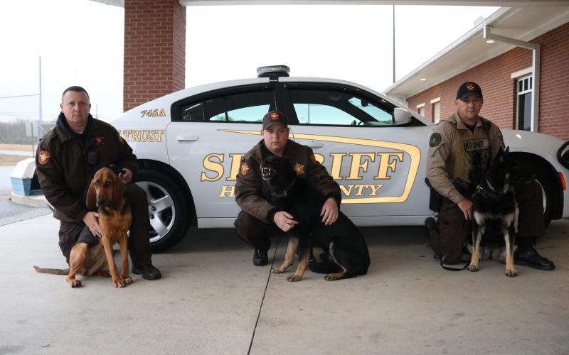 Sunshot by Grayson Williams - Pictured from left to right are, deputy Jarod Tollison and Parker Jean, deputy Josh Fowler and Chuck and deputy Steve Williams and Sena.