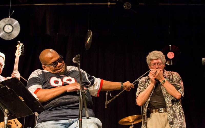 Photo submitted by Stephanie Crump - Walter Gordon, right, plays his harp on stage at High Cotton Music Hall in Hartwell recently with The Big C Clarence Cameron.