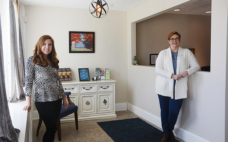 Hart County Chamber of Commerce director Christine Blomberg and Tiffany Rucker stand in the lobby of the chamber offices on Carolina Street. 