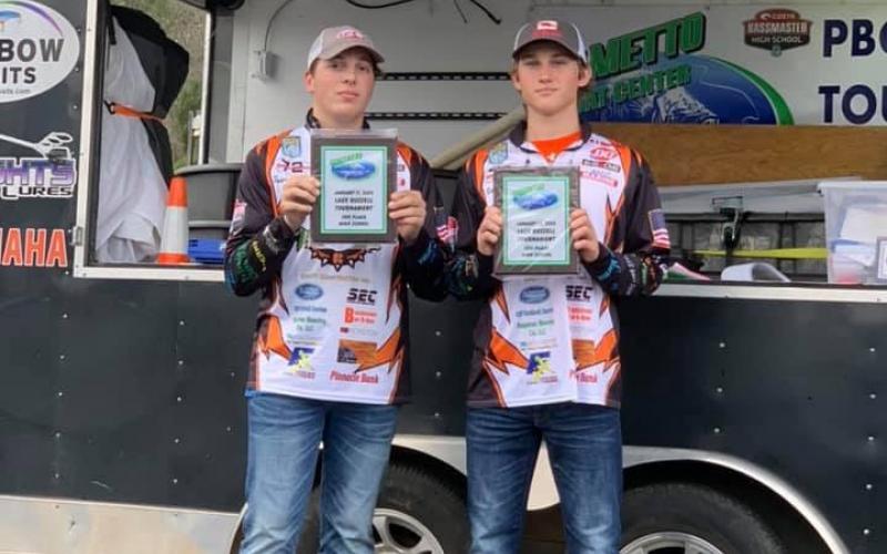  Photo submitted - Parker Dickerson, left, Rafe Maxwell, right, show off their third-place plaques at the PBC tournament on  Lake Hartwell. 