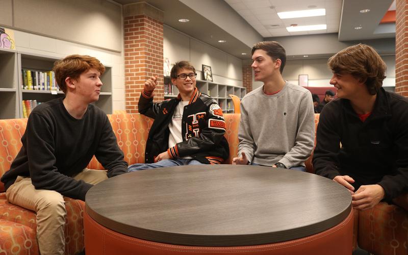 Leadership Hart Youth participants Sean Leard, from left, Ben Tellano, Adam Walters and A.J. Johnson talk about their project at Hart County High School recently. 