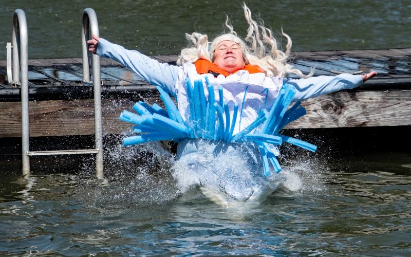 Sunshots by Bill Powell - April Garner, representing The Hartwell Service League, dressed as Alice in Wonderland, plunges after raising $1,700 for the council.