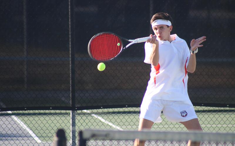 Sunshot by Grayson Williams - Hart County’s Zach Foley returns a ball in the No. 1 doubles match last Thursday against Madison County at Hart County High School.