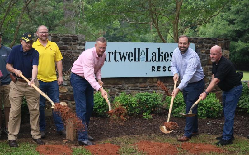 Sunshot by Grayson Williams — Hartwell Lakeside campground operator Barry Stern, from left to right, Chris Rademacher of Kampgrounds of America, U.S. Rep. Doug Collins, Hartwell mayor Brandon Johnson and Hartwell city councilman Tray Hicks ceremonially break ground on Hartwell Lakeside on Tuesday, June 23. 