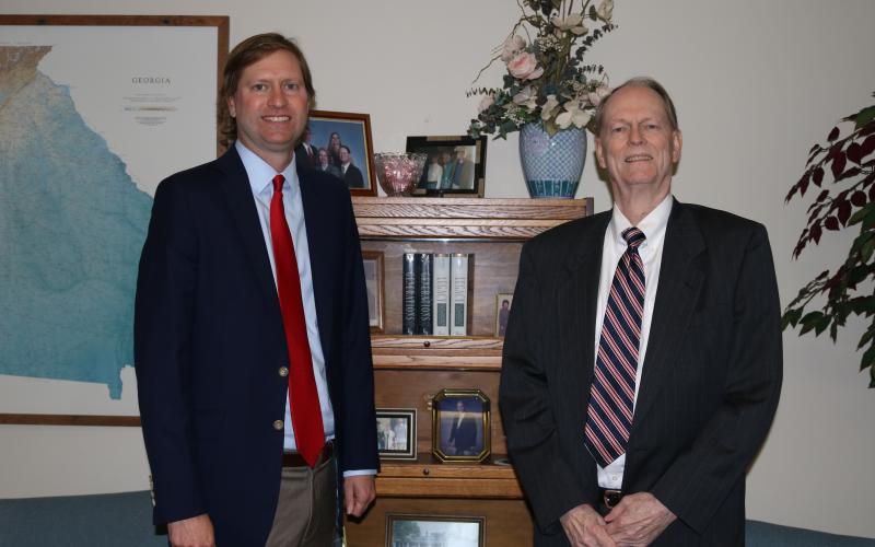 Sunshot by Grayson Williams — Ed Ridgway, left, and father Bob Ridgway, right, pose for a photo at the law offices of Ridgway and Ridgway. 